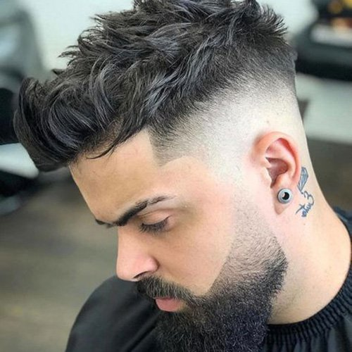 Side view of a guy rocking a beard fade