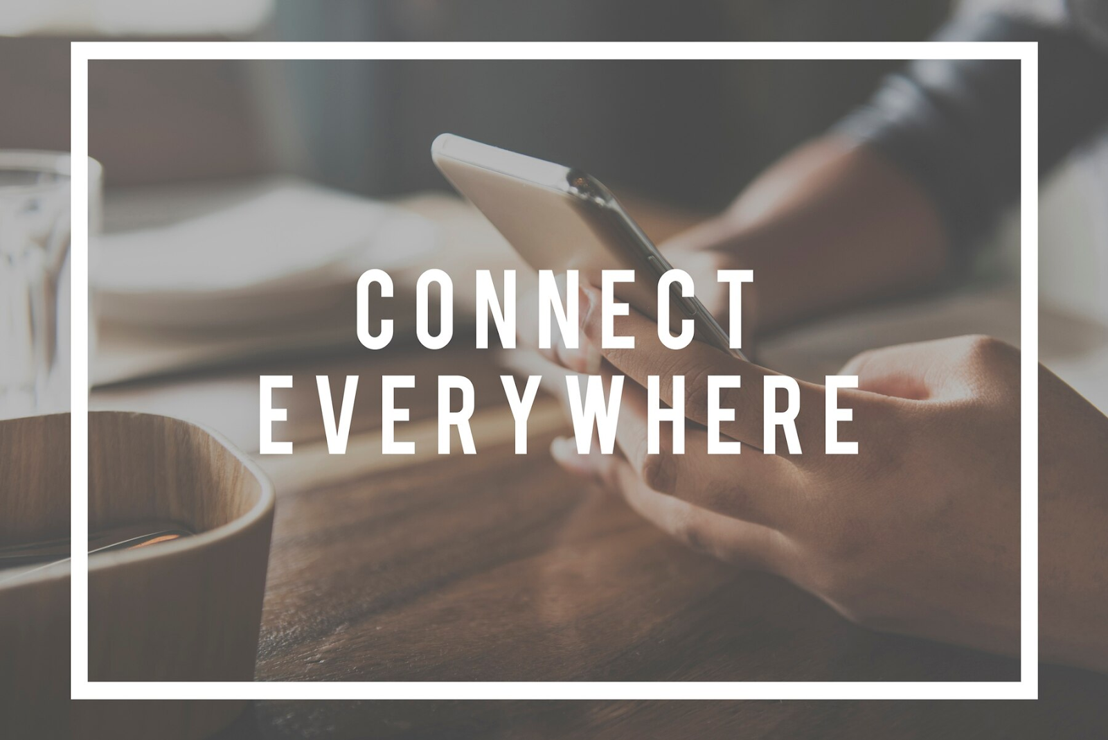 The words "connect everywhere" with the image of a phone in the background.