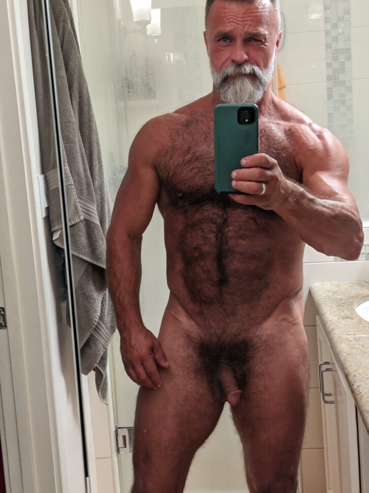 Daddy John naked taking an iphone mirror selfie  showing off his hairy chest and flaccid cut cock