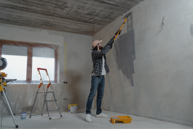 how to prepare for your self managed home remodel tips and advice from a design build team homeowner painting walls during remodeling project custom built michigan