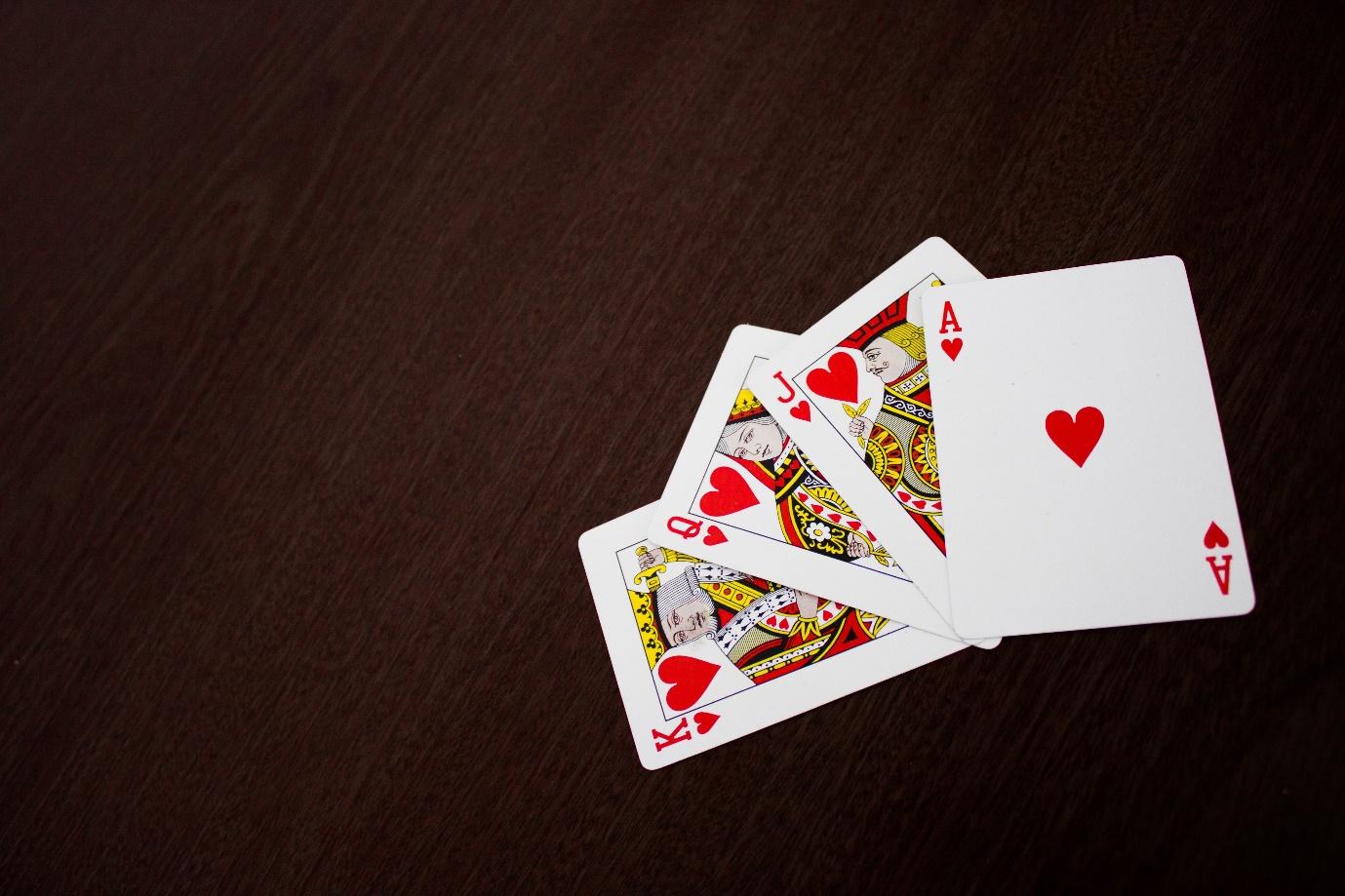 A close-up of a deck of cards

Description automatically generated