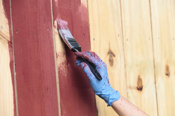 painting a fence