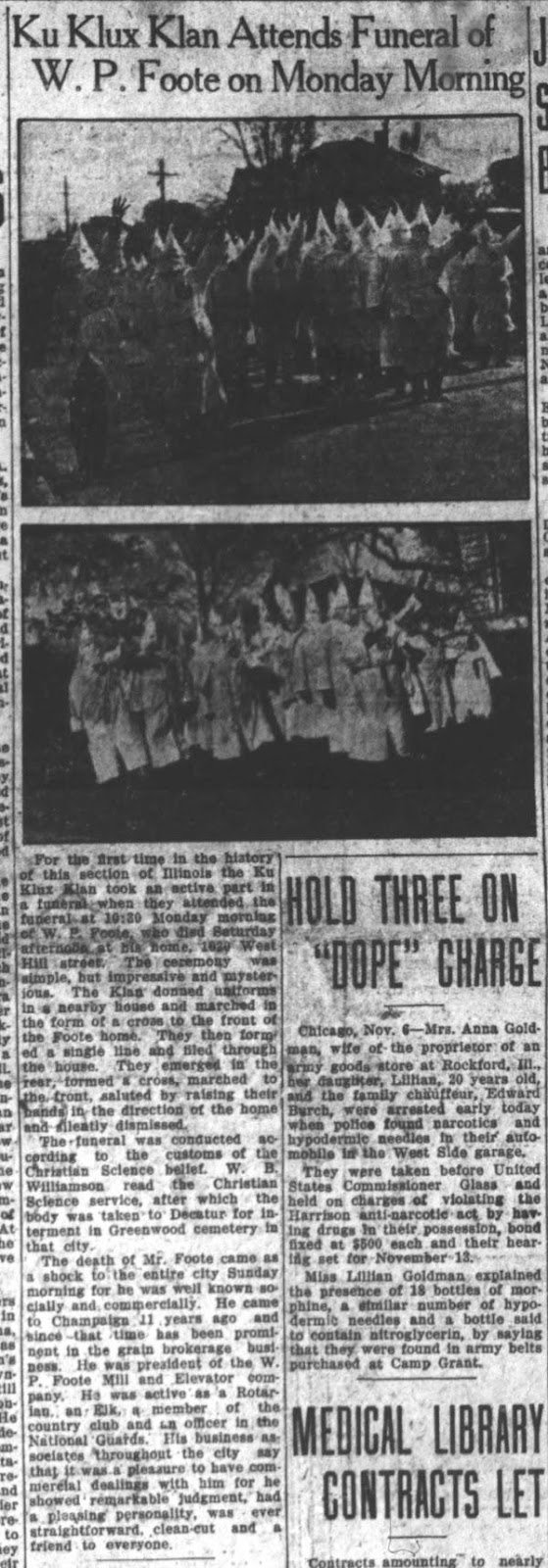 Ku Klux Klan gathering in Champaign-Urbana. A black and white scan of a newspaper article of a large group of people wearing white robes and hoods marching with their hands in the air. 