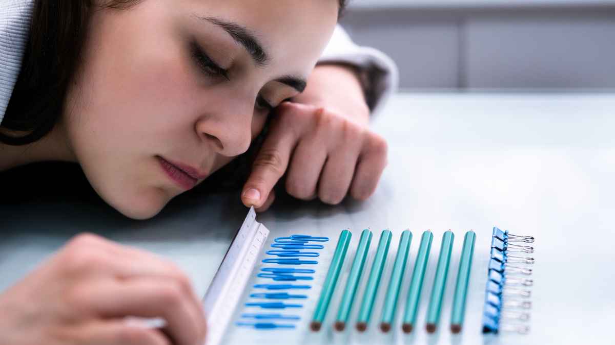 Woman lying down and pointing at a ruler MSN with OCD