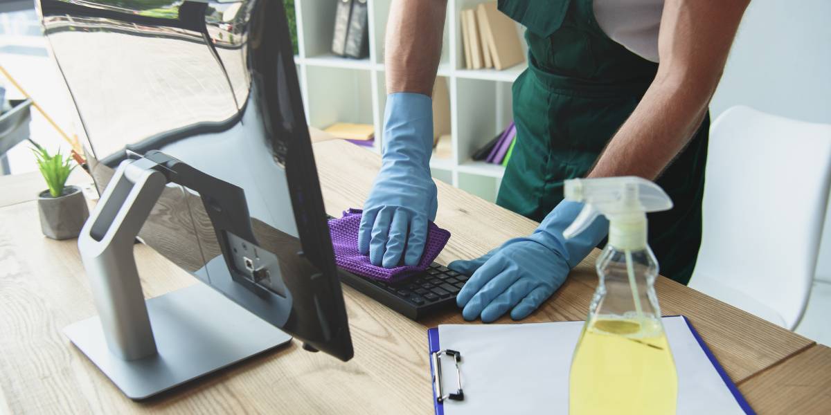 A workspace getting cleaned with office cleaning services.