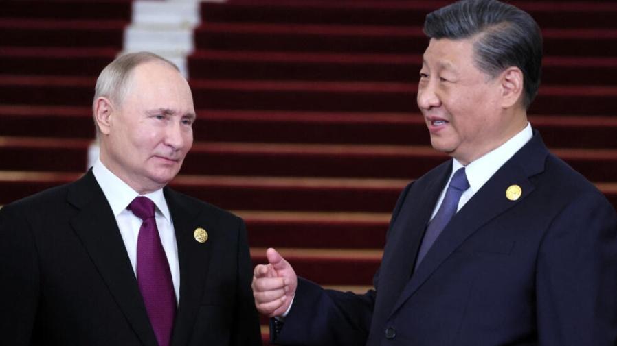Russian President Vladimir Putin speaks with ChineseÂ PresidentÂ Xi Jinping during a welcoming ceremony at the Belt and Road Forum in Beijing, China, October 17, 2023.