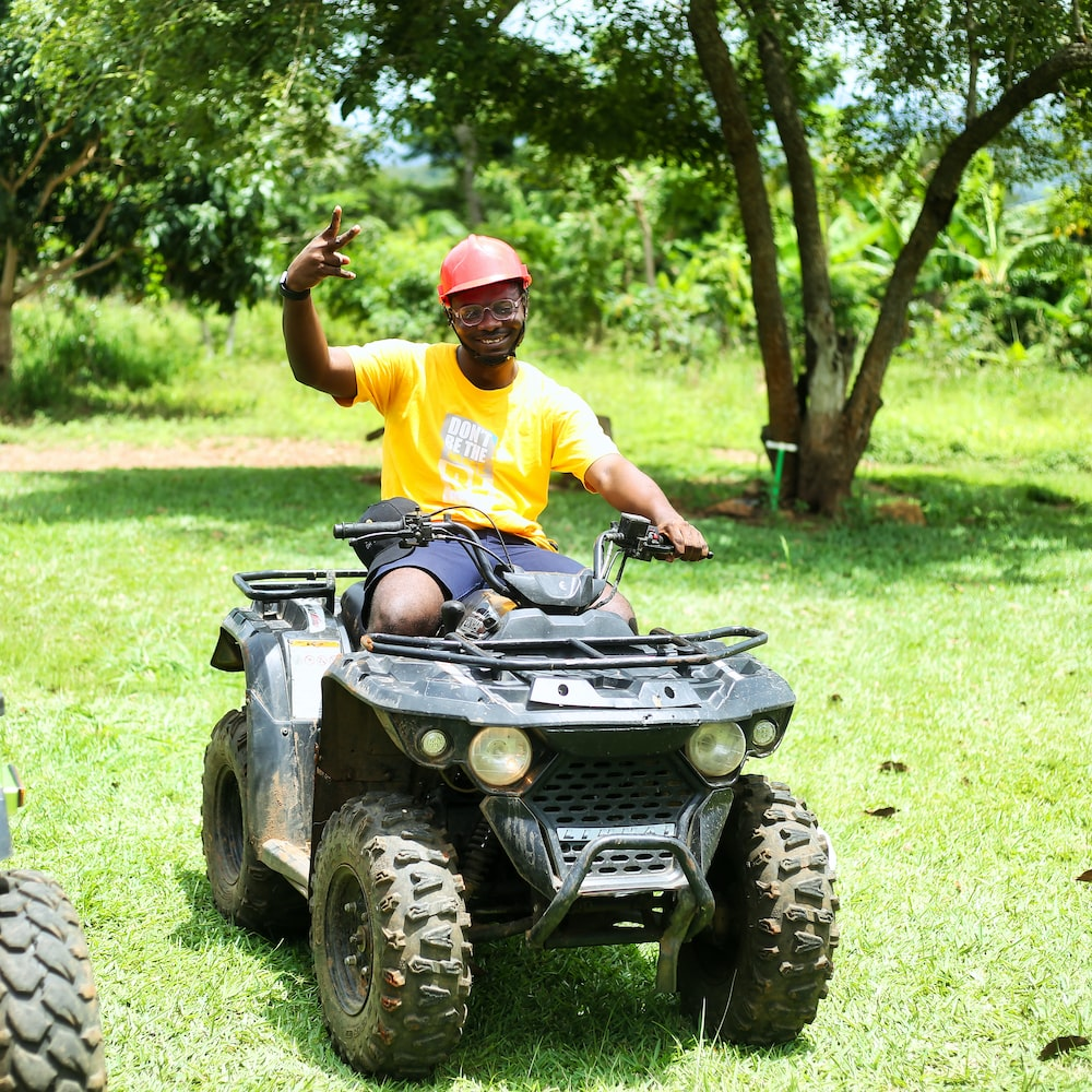 Boy With Red Cap Driving Quadbike