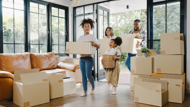 Kids and Parents  Excited to Move In New House With Packed Cartons Around
