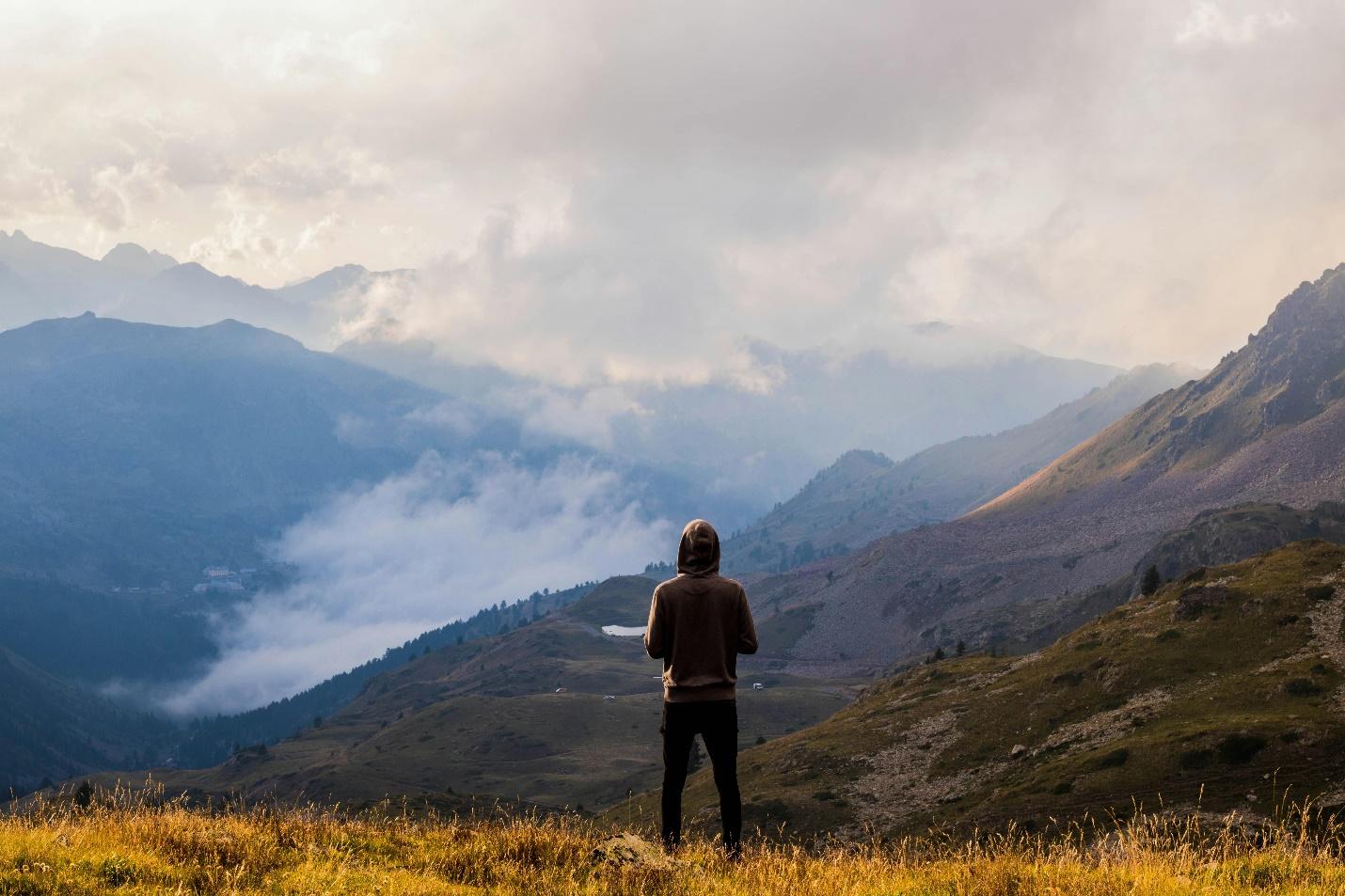 IMAGE SOURCE: https://www.pexels.com/photo/person-wearing-brown-pullover-and-black-jeans-standing-on-mountain-top-with-the-scenic-view-3163927/