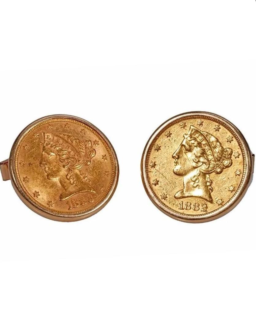 A gold coin with a head of a person

Description automatically generated