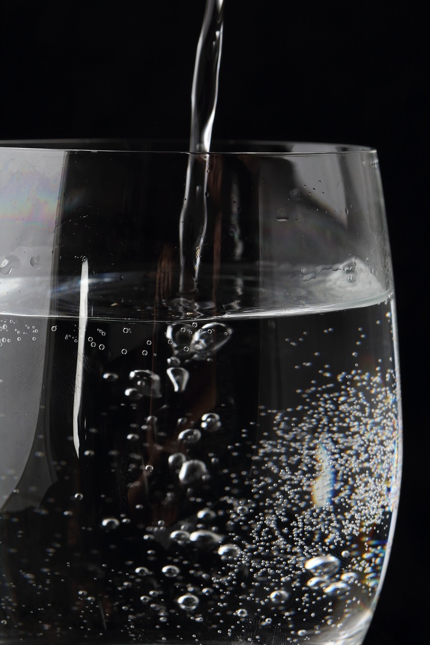 A glass being filled with water.