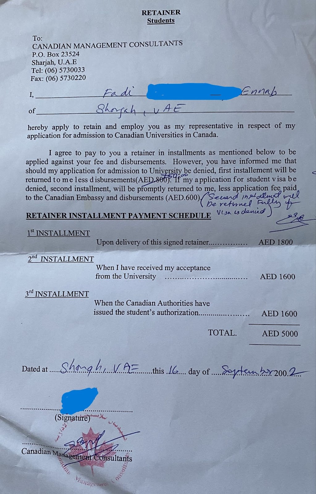 Photo of retainer signed by Fadi in 2002 that details the payment schedule for getting accepted to university and awarded a study permit.