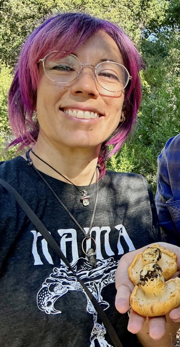 Jess Starwood holding a mushroom