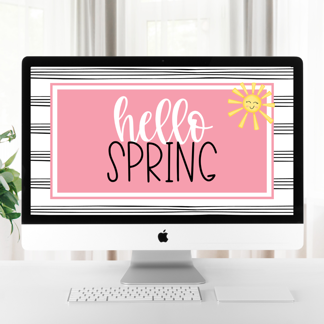 This image shows a computer with a slide showing that reads "Hello Spring" on a bright, pink background. 