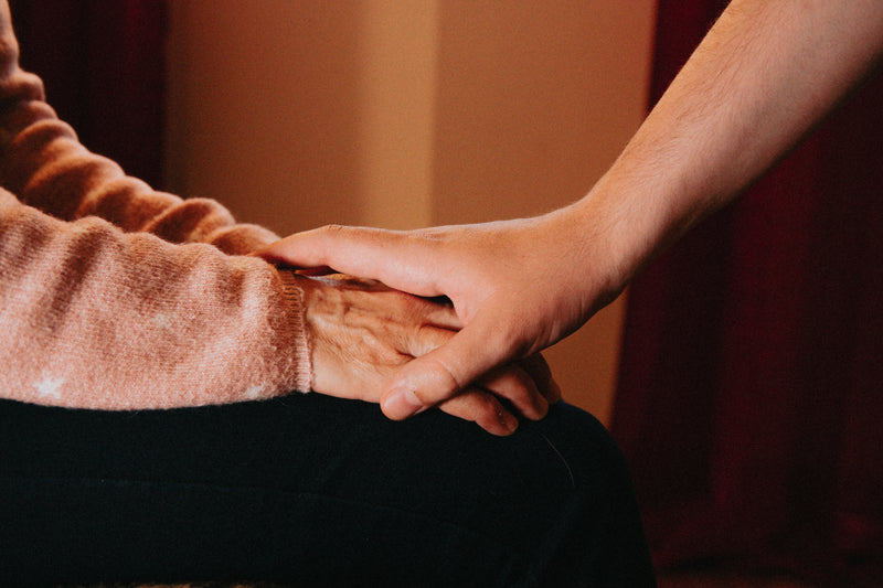 resting hands on top of someone elses hands - Image of Gemstones, An image of a person meditating wi