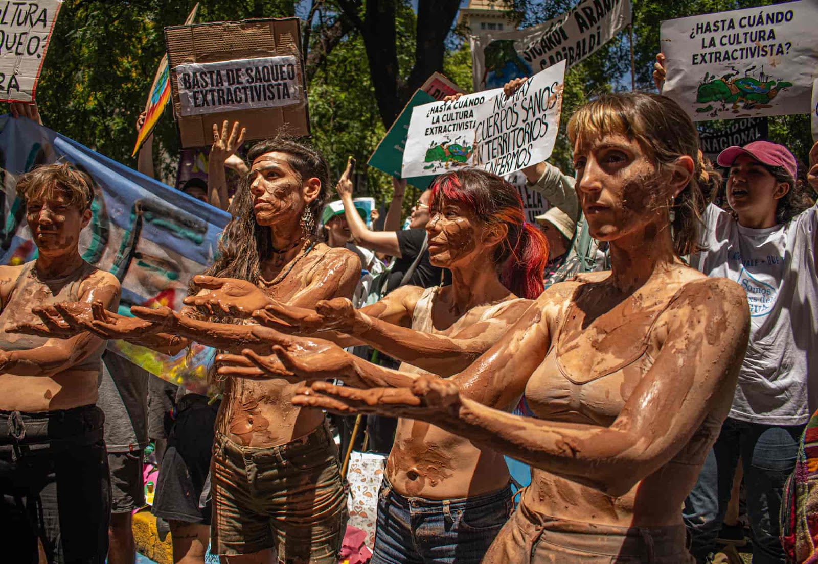 Rebels covered in mud do synchronised moves as part of a huge rally