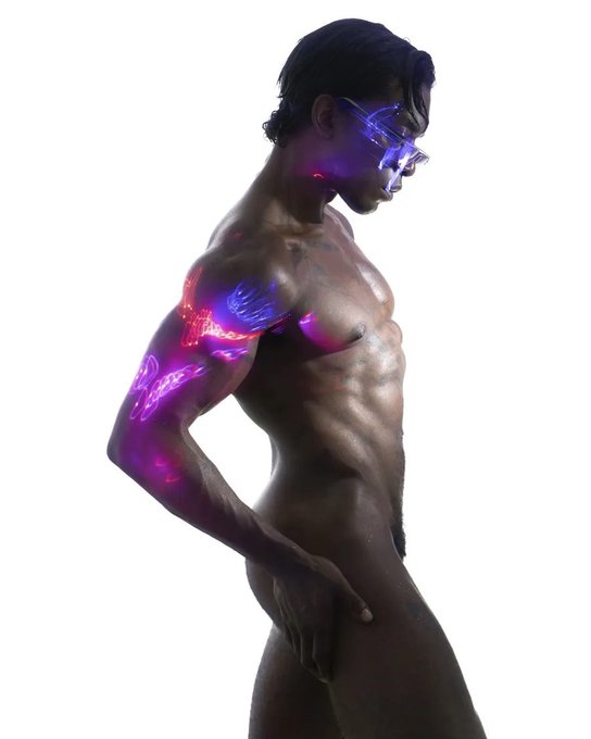 Jordan Jameson posing naked with butterfly led light effects