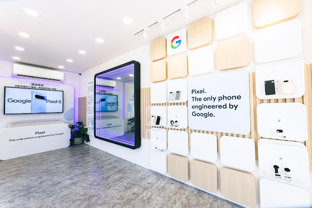 Image 2: 一個明亮現代的展示廳，重點展示 Google Pixel 產品，包括展示 Google Pixel 8 手機的展示區、強調其為「唯一由 Google 設計的手機」的標語，以及在貨架上展示的各種 Pixel 設備