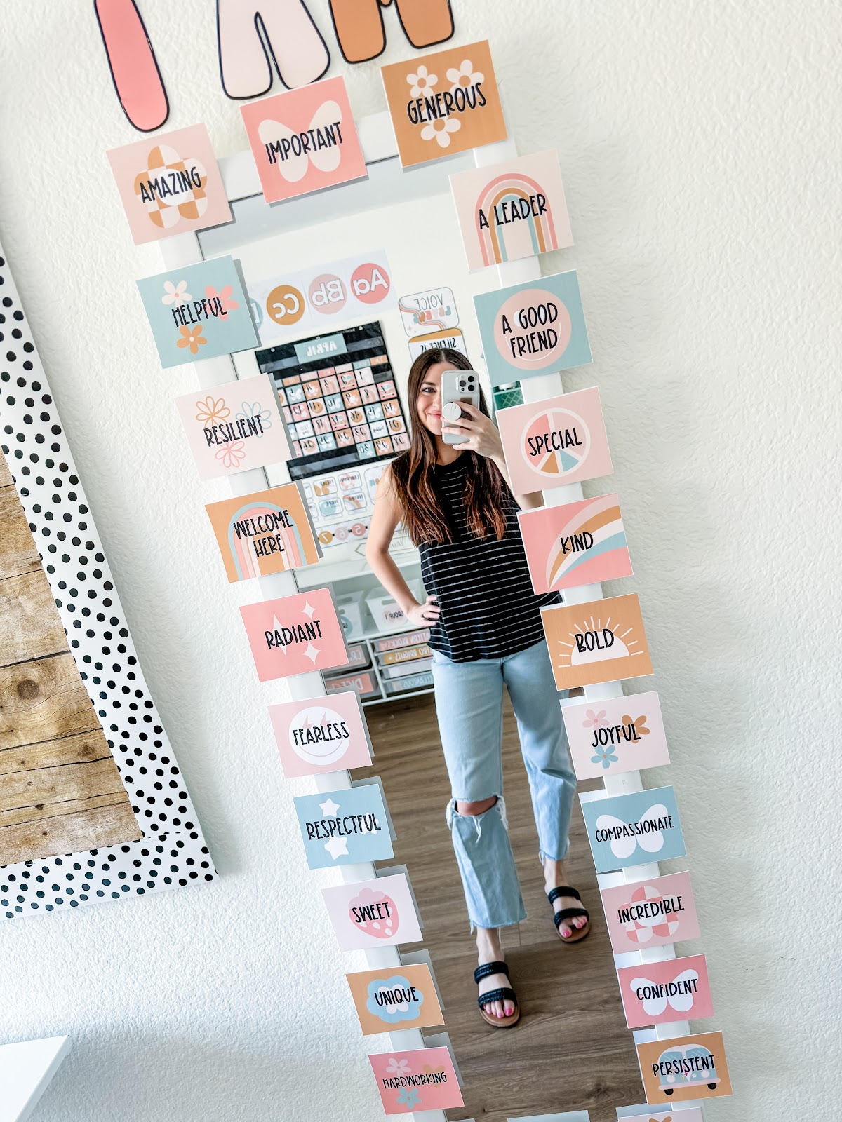 This image shows a mirror with square papers all around the sides of the mirrors. On each square is an "I Am" statement. 