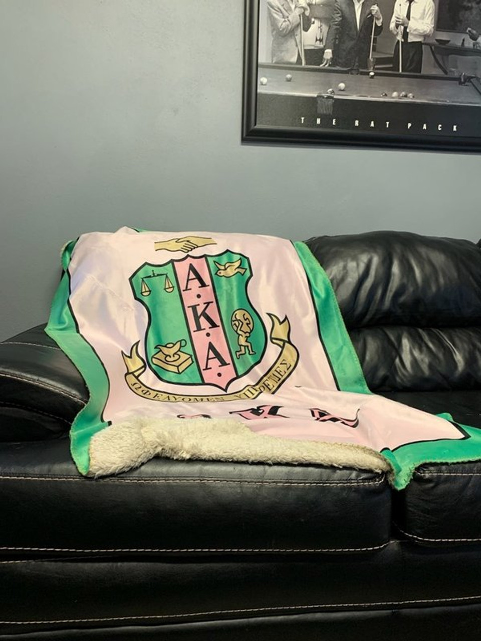 Sorority Crest Blankets, like this AKA one, make a cozy new apartment gift for graduating seniors embarking on their new adult lives.