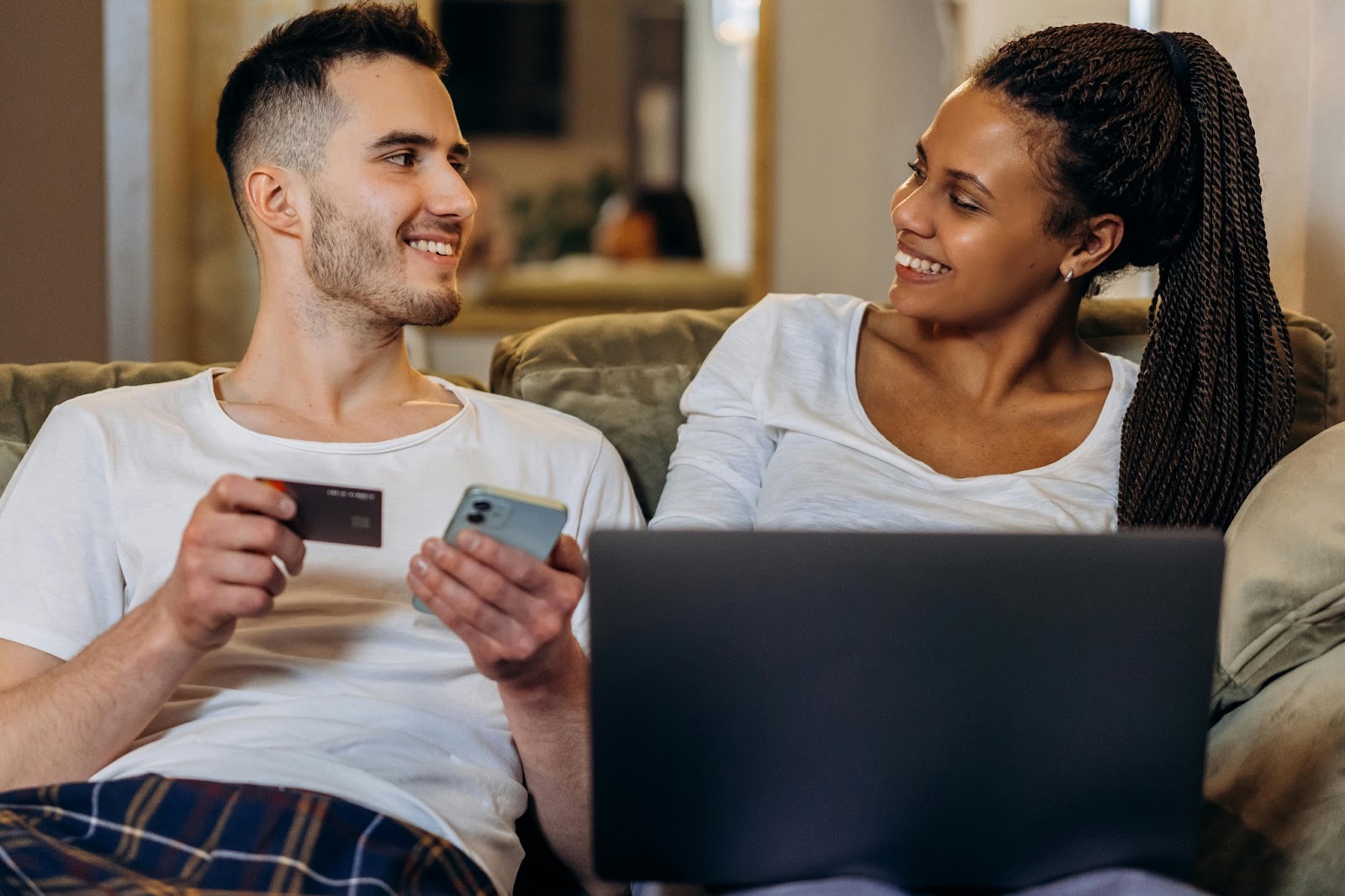 A joyful couple booking their wedding resort venue together. 