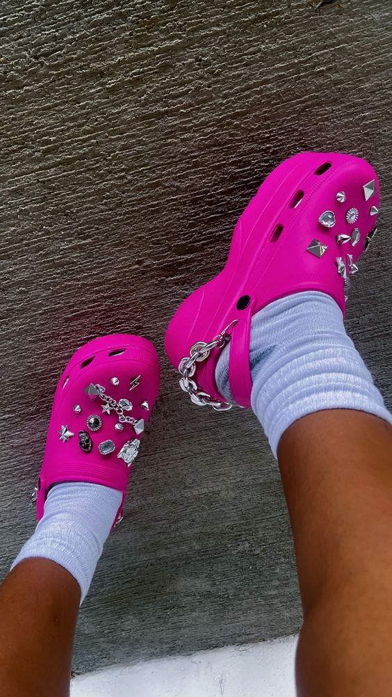 Picture showing an accessorized pink baby crocs
