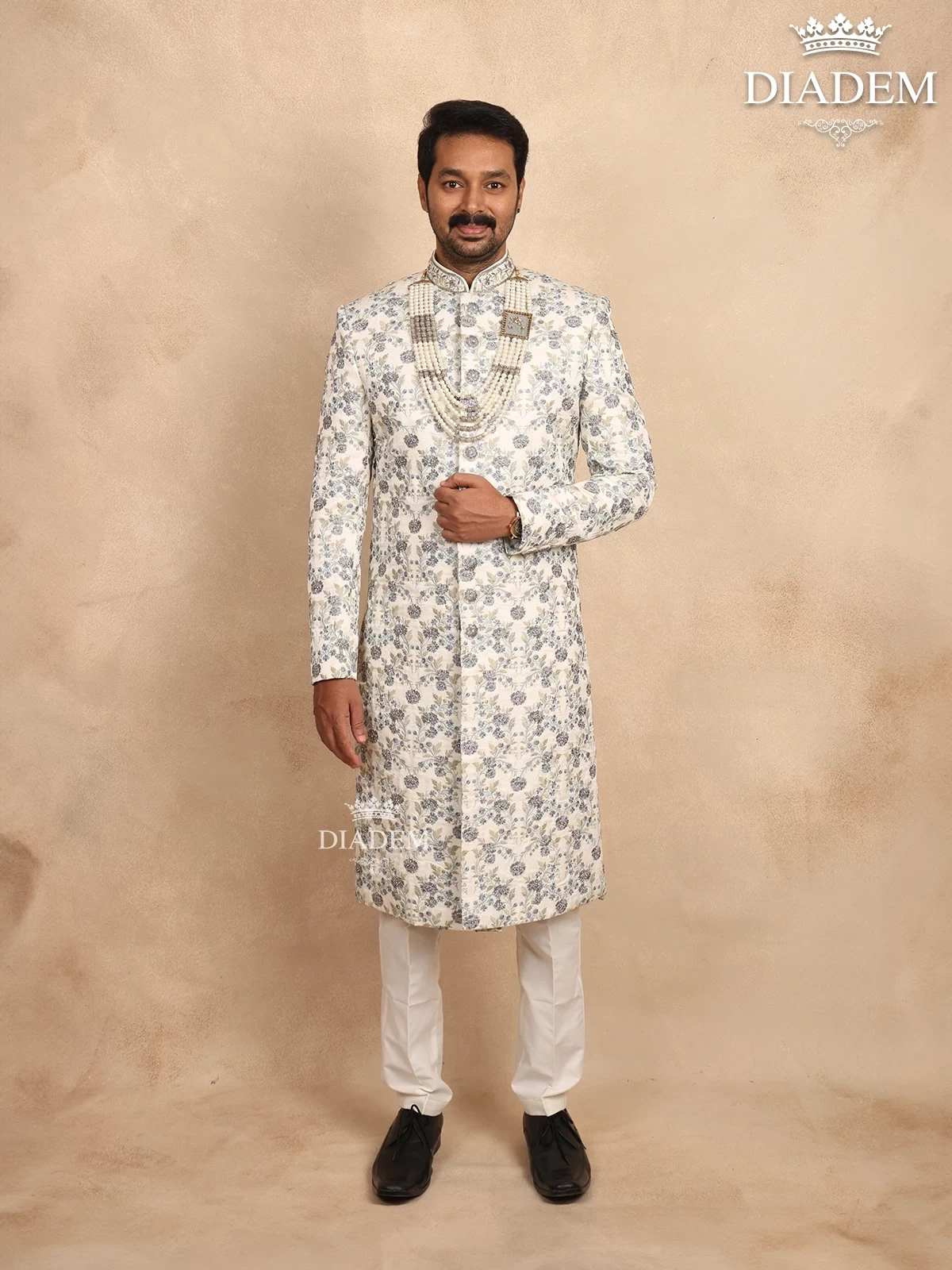 Cream Raw Silk Sherwani Suit with Floral Threadwork Embroidery, Paired with Bead Mala