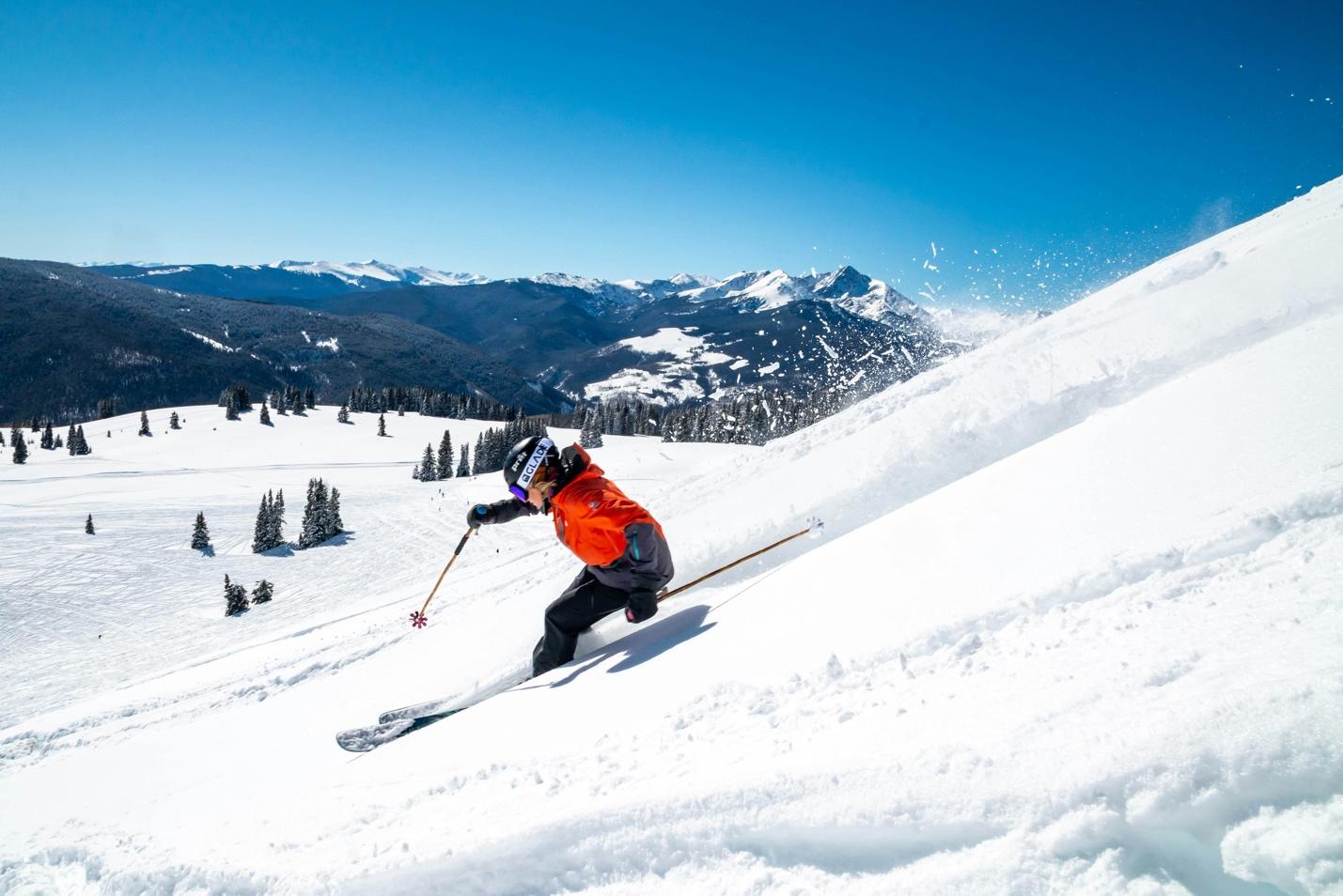 A person skiing down a snowy mountain

Description automatically generated