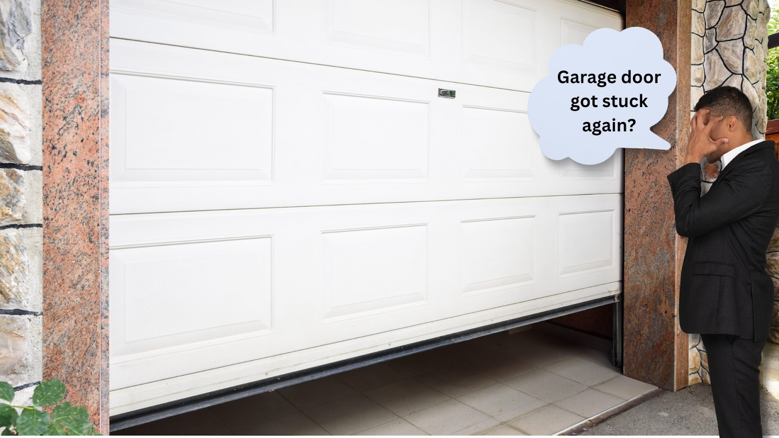 A homeowner looking at their misaligned garage door and feeling frustrated because it was stuck again