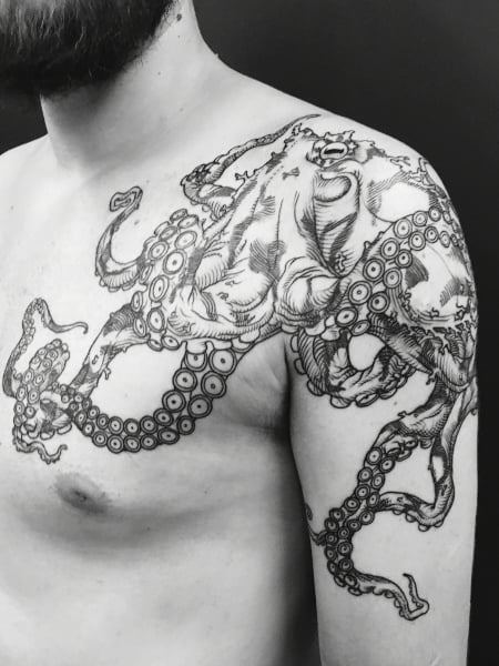 Picture of a guy rocking the polynesian  octopus tattoo design