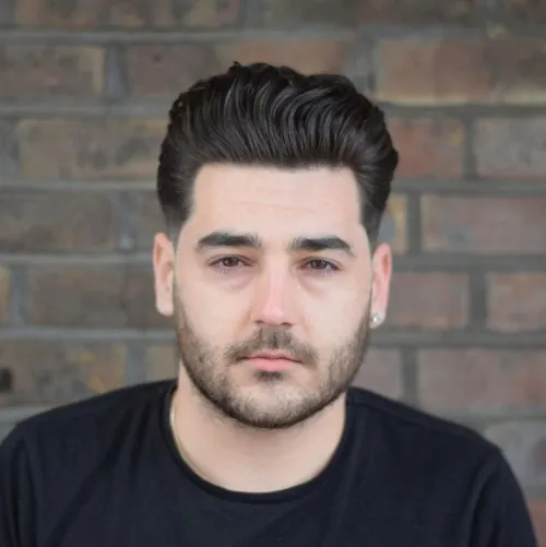 Wavy hair men: Modern Wavy Quiff with Low Fade