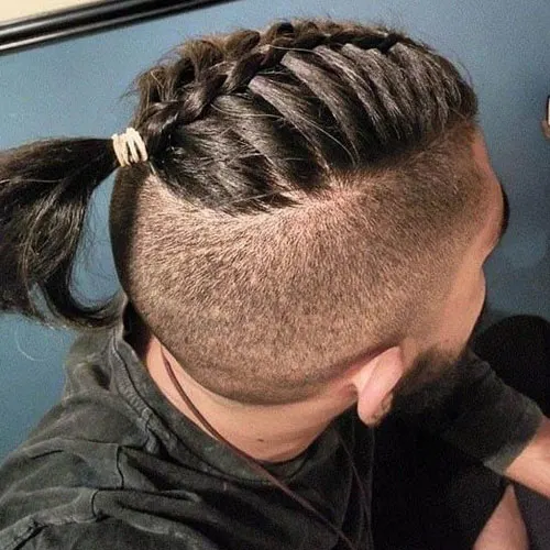 Picture showing a guy rocking the single braids
