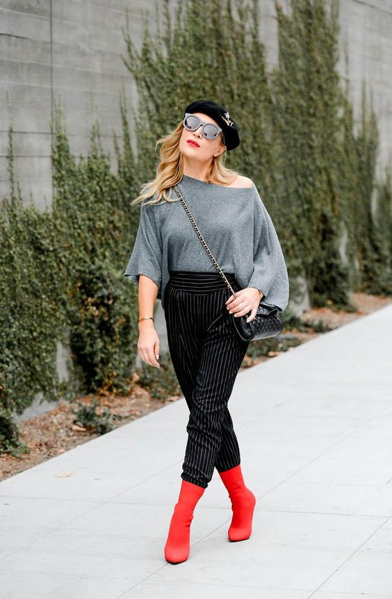 One-shoulder top and pinstripe stirrup pants are classic style