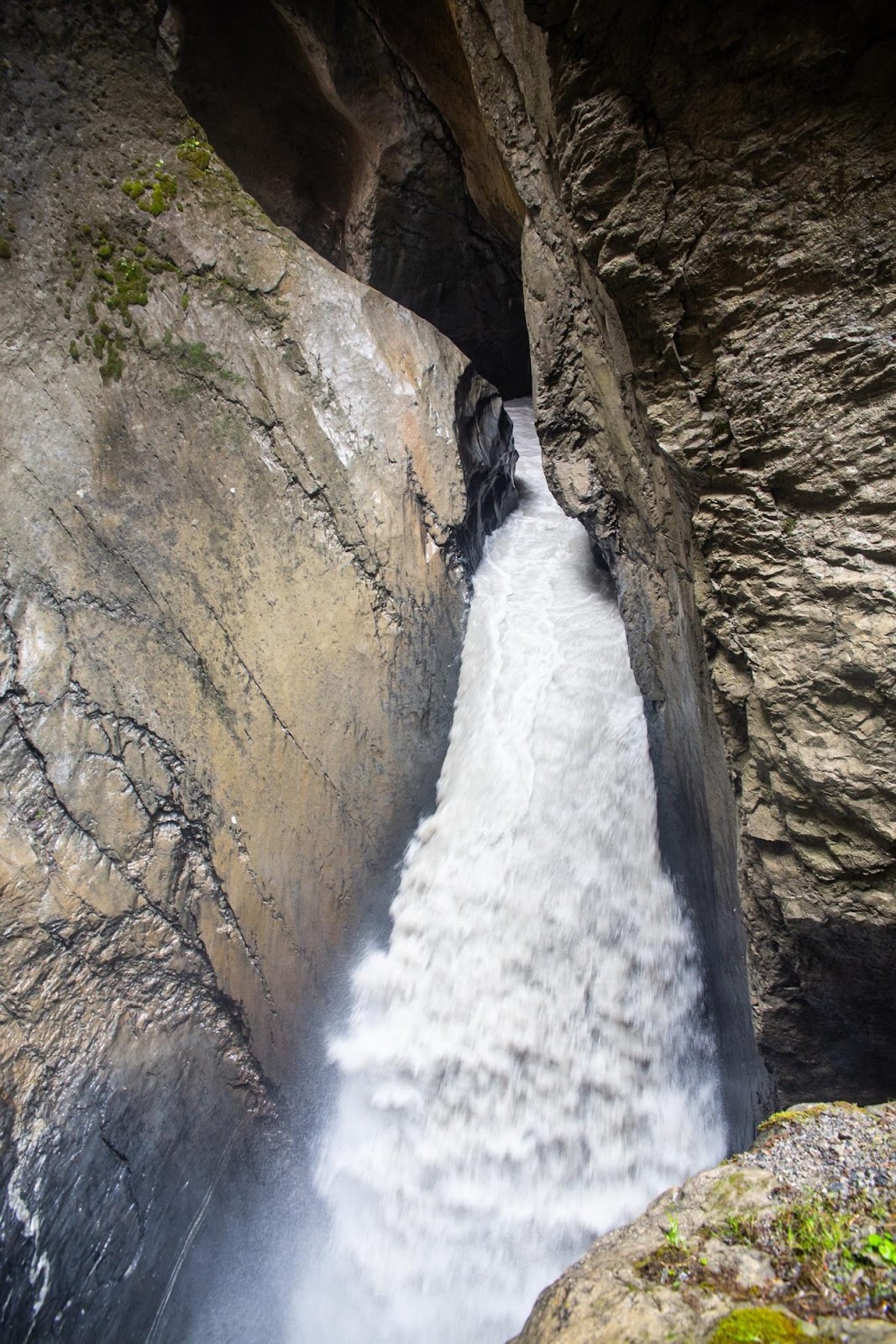 A waterfall in a canyon

Description automatically generated