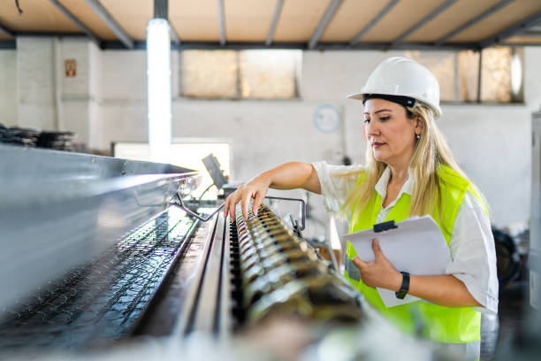 a female machine operator operating a machine