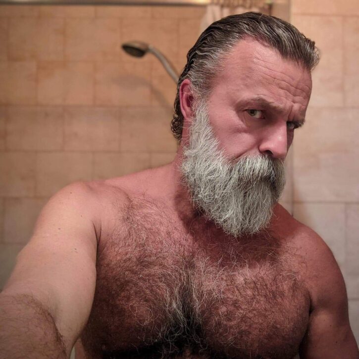 Daddy John posing shirtless in the shower showing off his hairy chest