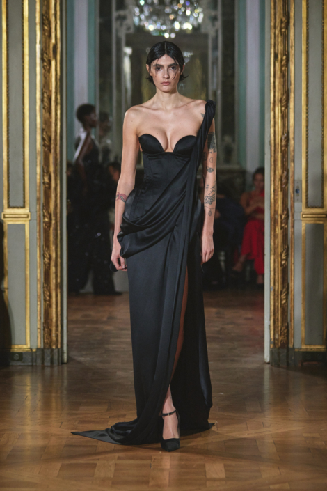Picture showing a model looking  stunning in a  velvet strapless gown for the Ashi collection at the event