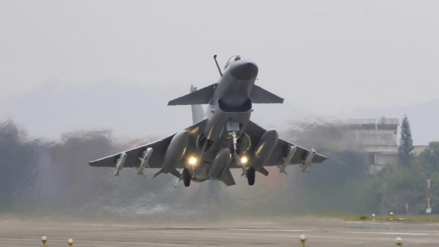 In this photo released by Xinhua News Agency, a fighter takes off during the combat readiness patrol and military exercises around the Taiwan Island carried out by the Eastern Theater Command of the