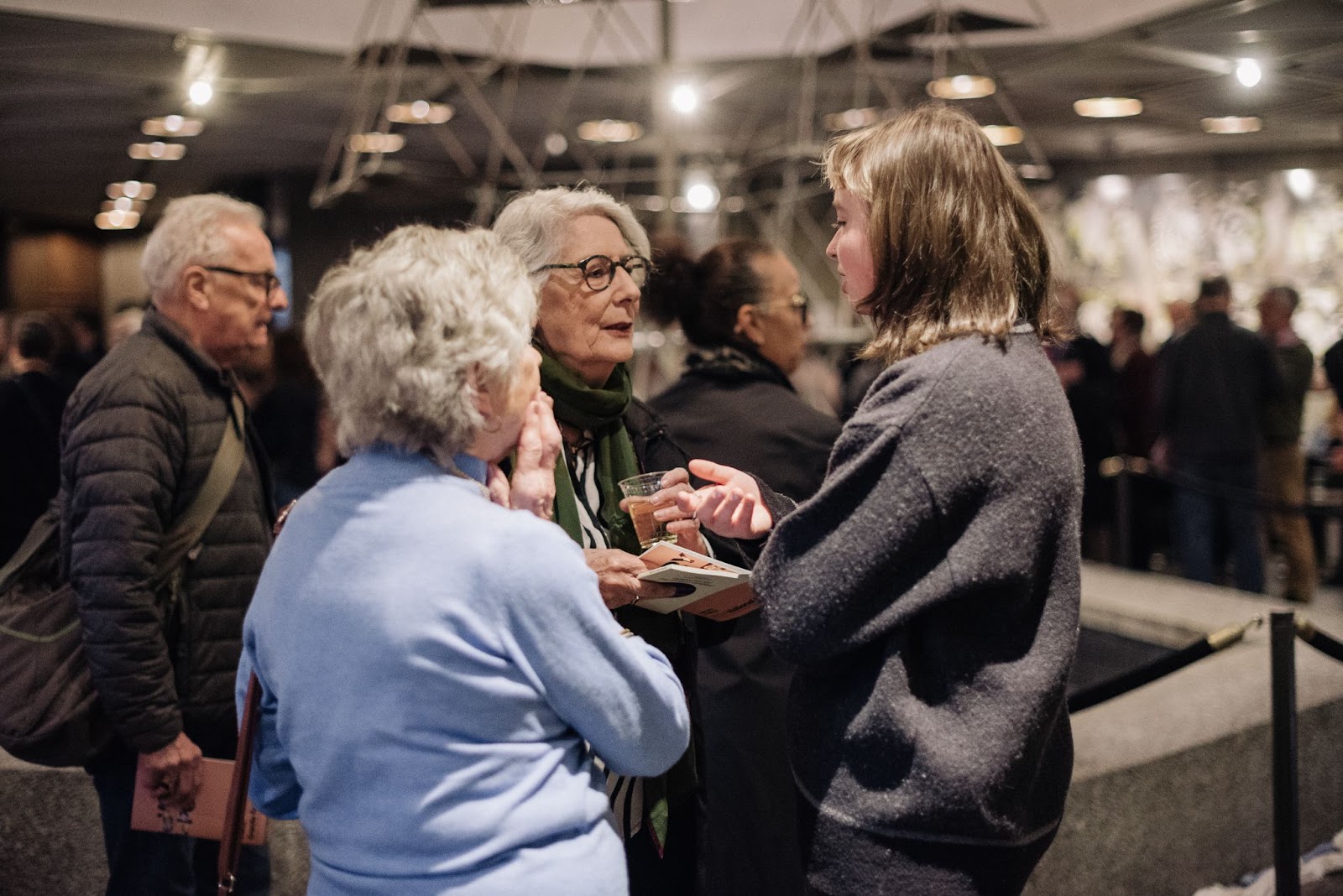 The audience arrives in good spirits for the pre-show reception. 