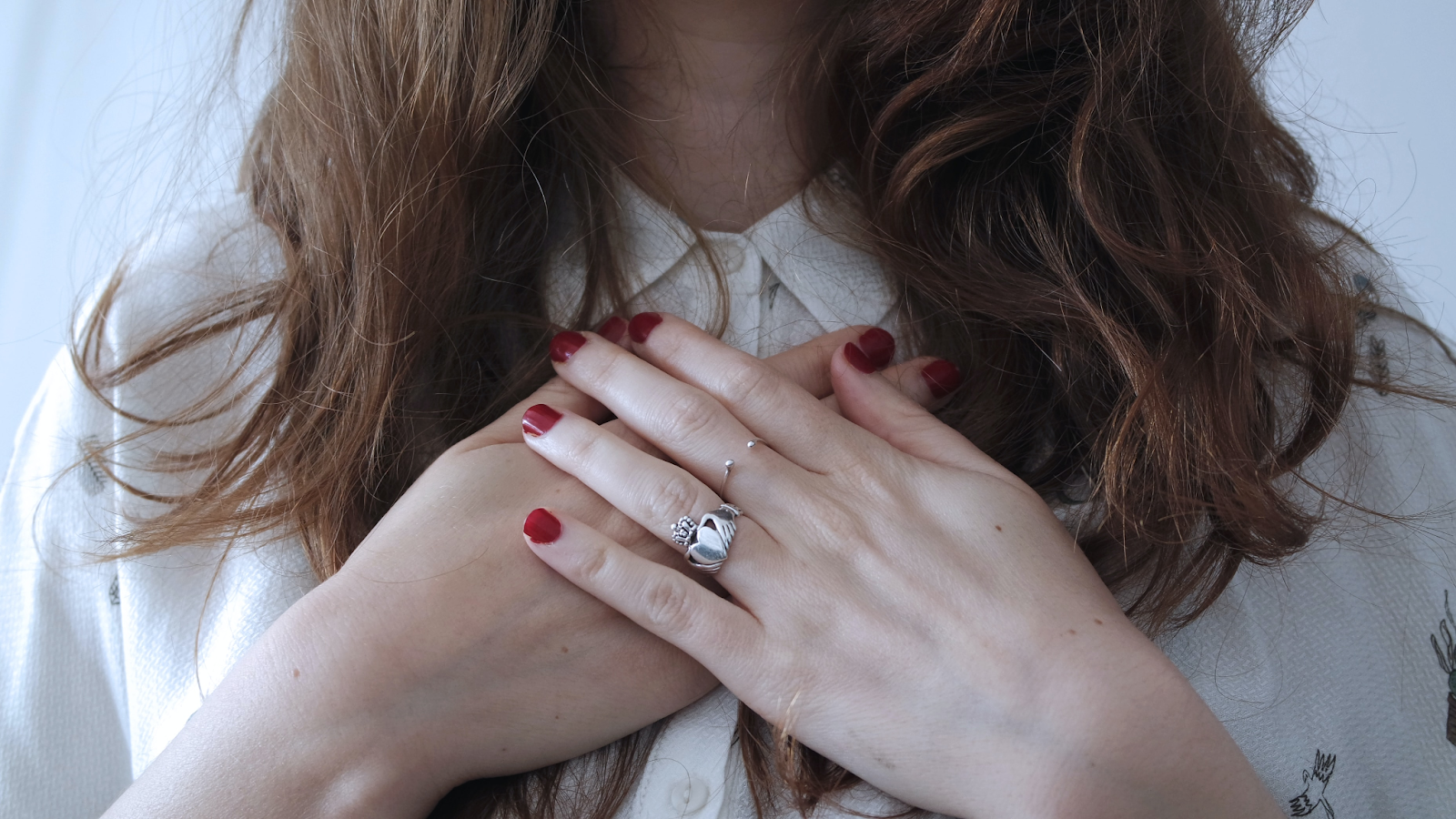 Young women placing her hands at chest for emotional stability