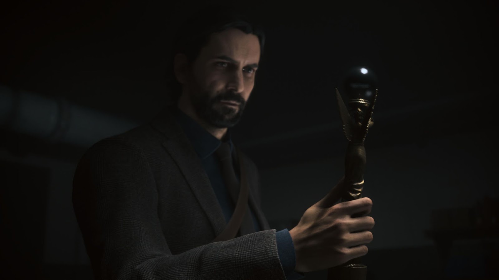 An in game screenshot of Alan Wake with the Angel Lamp from Alan Wake II. 