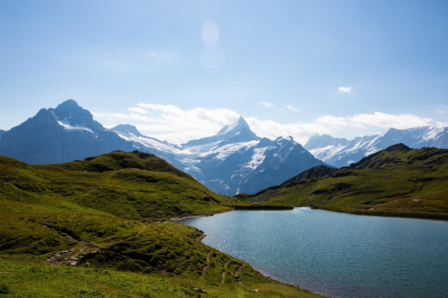 A lake surrounded by mountains

Description automatically generated