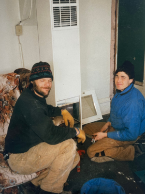 Photo of Bob Penny and the author David in front of a heater 