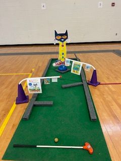 image of a mini golf lane set up in the gym