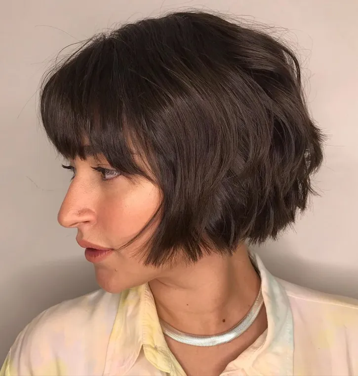 Picture of a girl rocking her Wavy Bob with Wispy Bangs