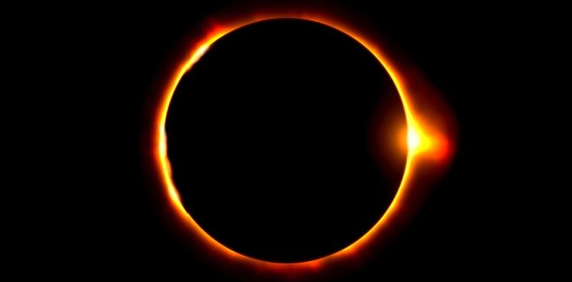 A solar eclipse with a ring of fireDescription automatically generated