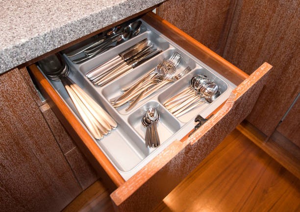 Cutlery Drawer With Compartments in luxury yacht kitchen Cutlery Drawer With Compartments in luxury yacht kitchen tool storage drawers stock pictures, royalty-free photos & images