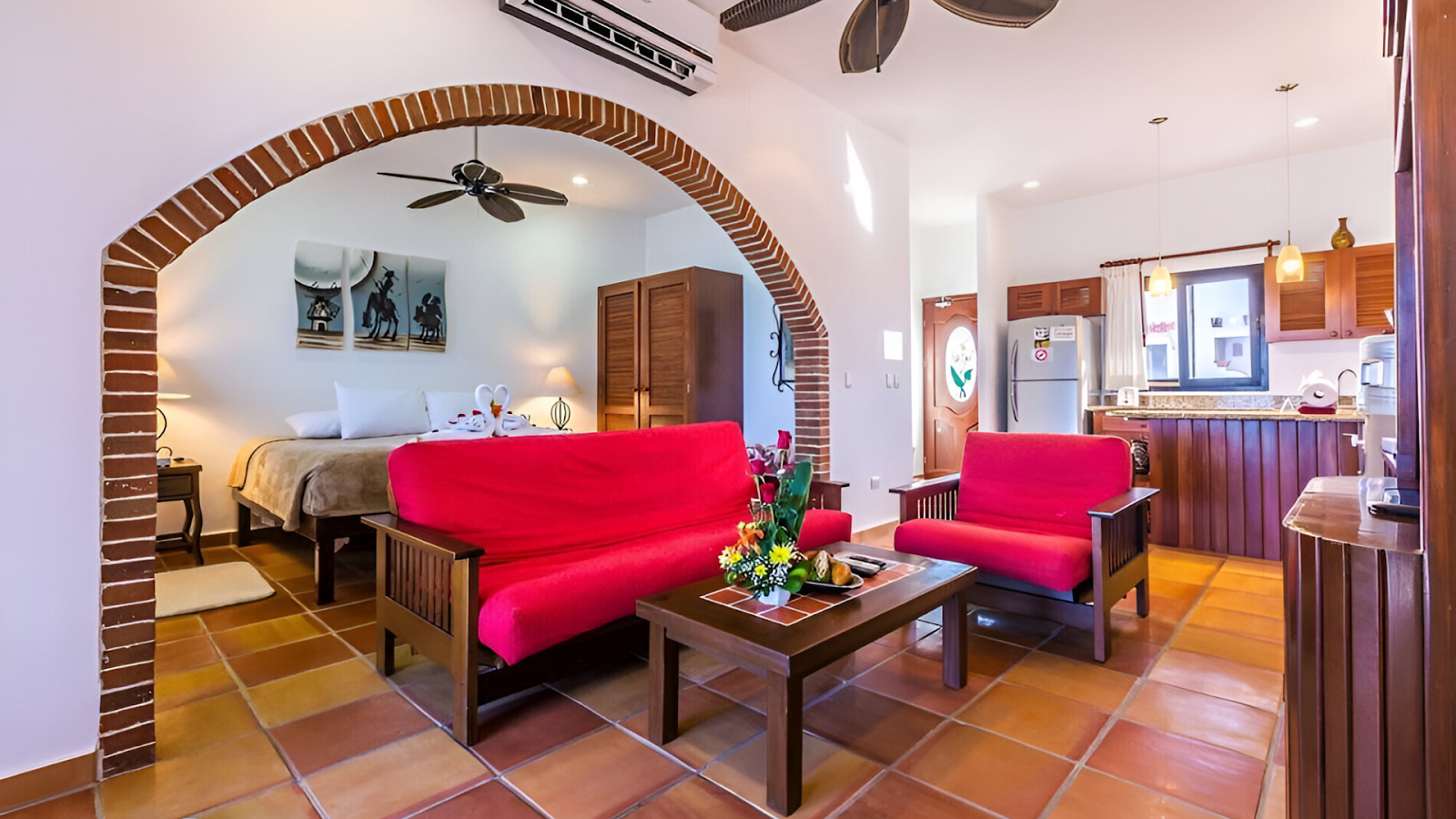A bedroom with a sitting area of a vacation rental in Cancun