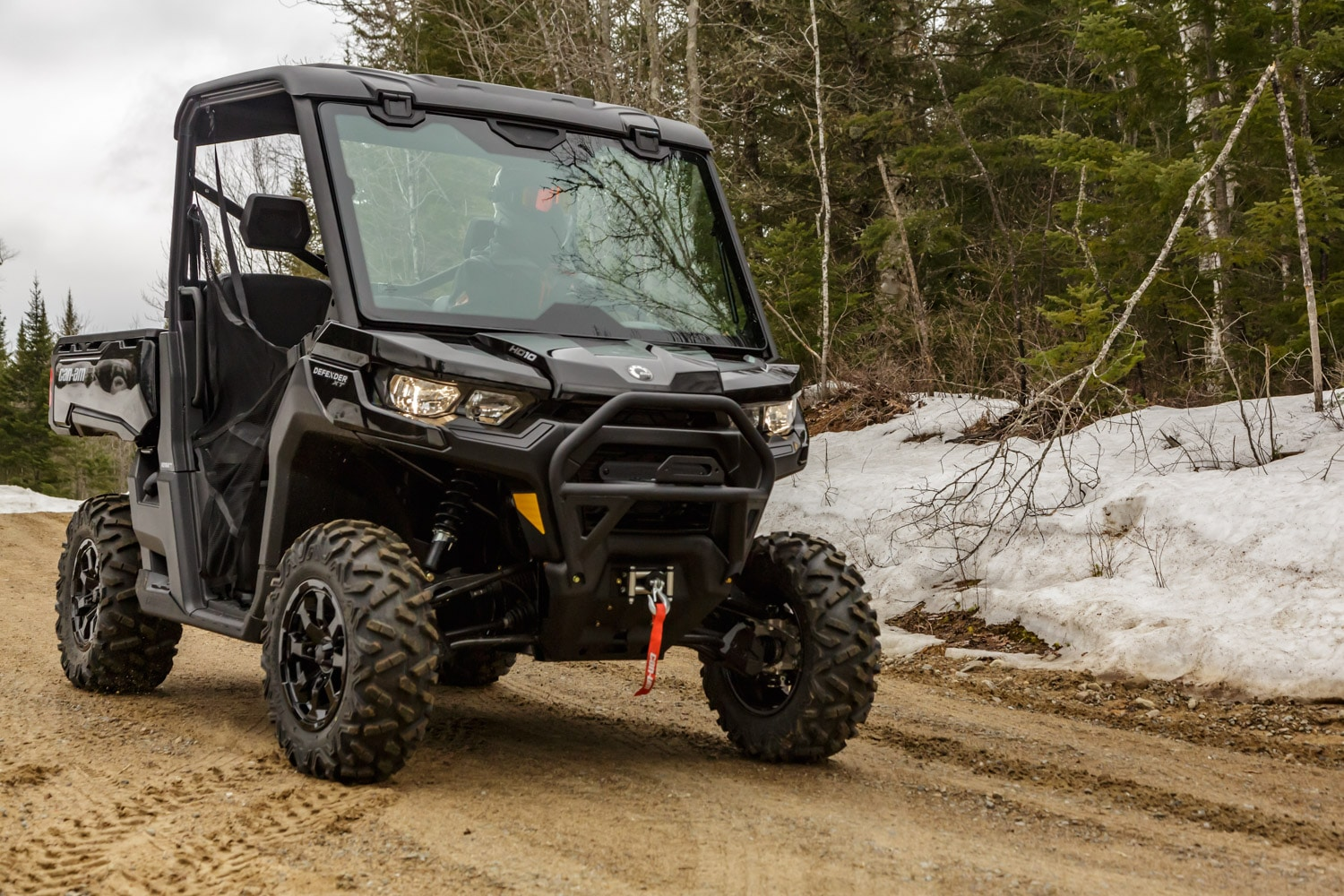 The Can-Am Defender XT pictured parked on a trail
