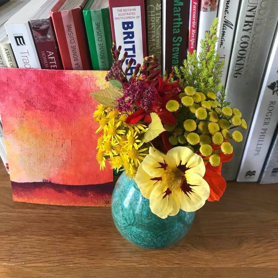 Slowing down makes space for small joys: painting from the heart, gathering blossoms.